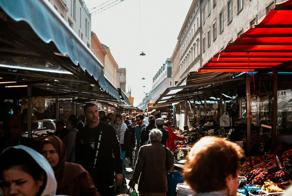 Naschmarkt food stalls in Vienna with affordable snacks and casual meals