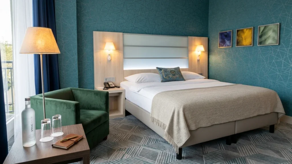 Cozy hotel room in Linz, Austria with a comfortable double bed and modern travel accommodation atmosphere.