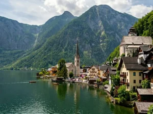 Panoramic view of Hallstatt village and lake surrounded by Alpine mountains