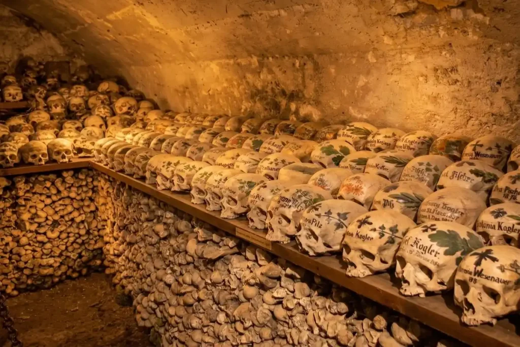 Decorated historic skulls displayed respectfully inside the Hallstatt Bone House.