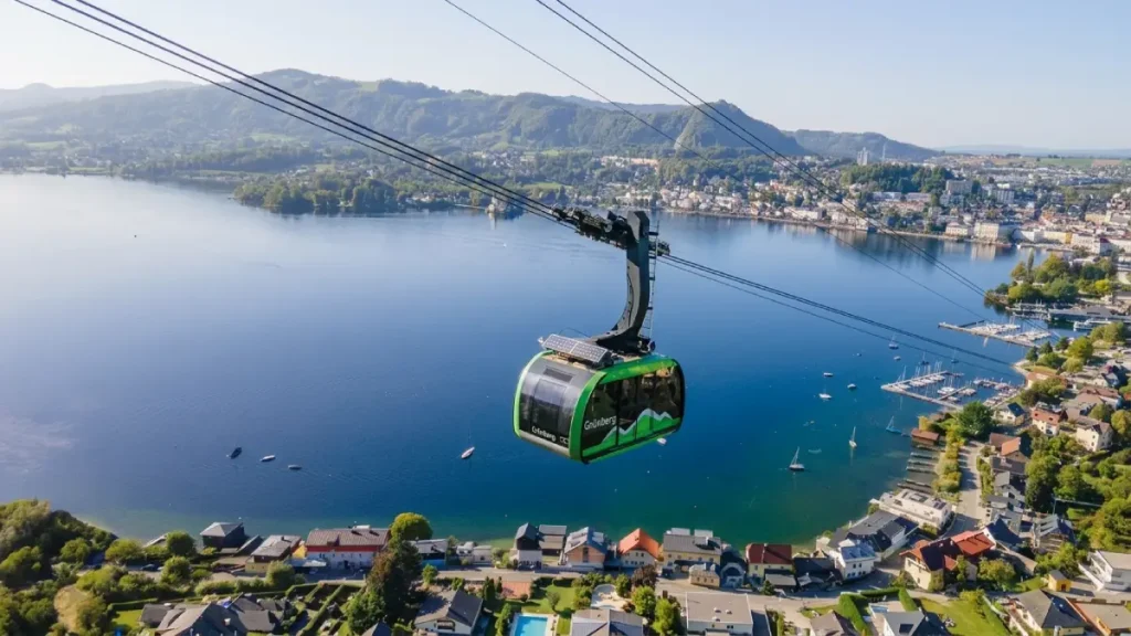 Grünberg cable car above Lake Traunsee in Gmunden, Austria with mountain views and the lakeside town below